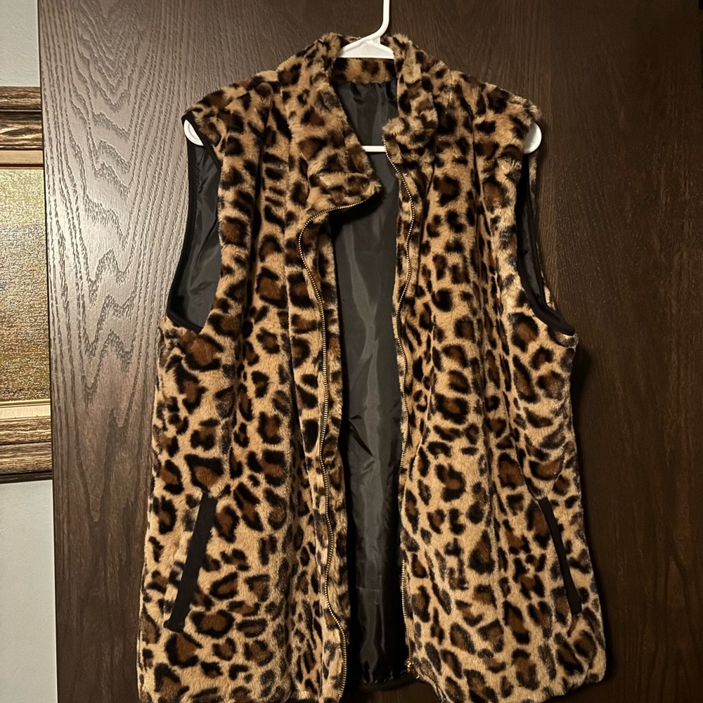 Leopard print faux fur vest.